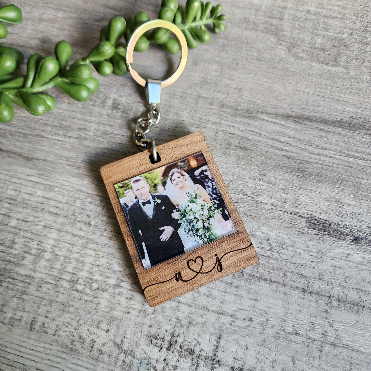 Keychain made from walnut, with a printed photo on the front and on the back is engraved with a custom message