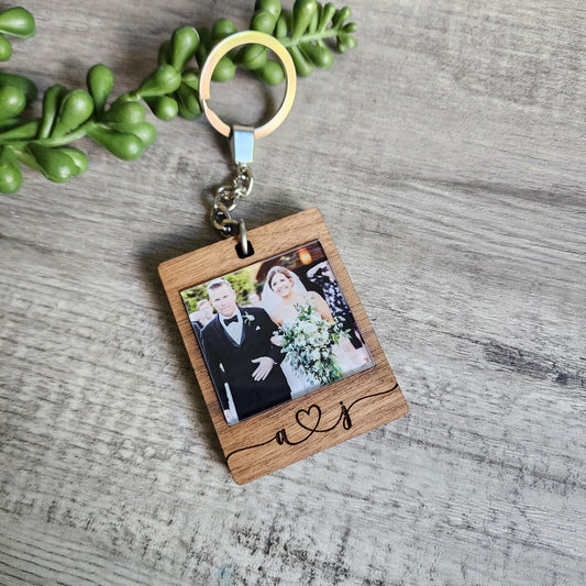 Keychain made from walnut, with a printed photo on the front and on the back is engraved with a custom message